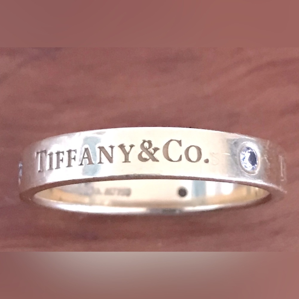 Authentic Tiffany & Co 18K gold & diamond double logo band ring. Sz9
